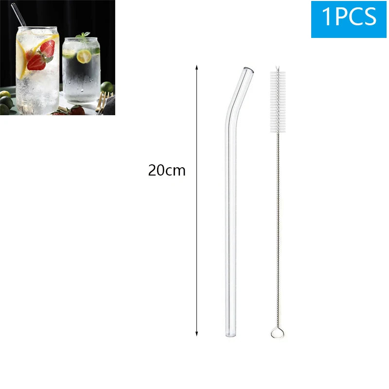 Clear glass straw and cleaning brush with a 20cm measurement on a white background.