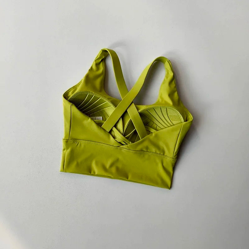 Green sports bra on a light gray background