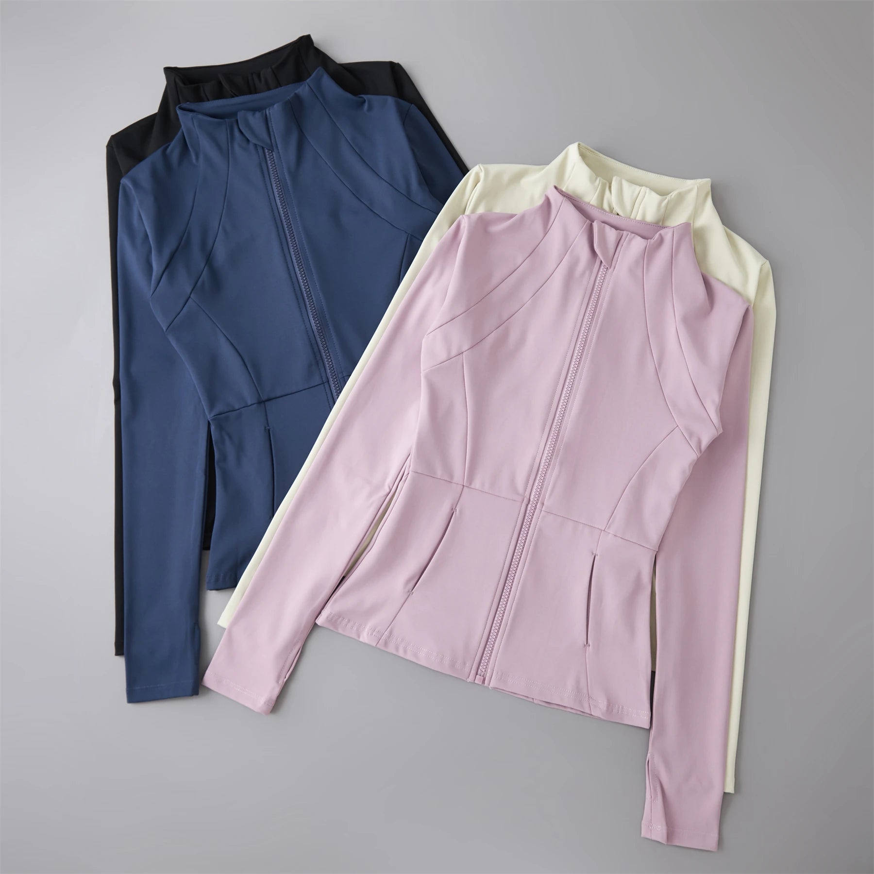 Women’s lightweight long-sleeve zip-up athletic jacket for running, workouts, and everyday activewear.
