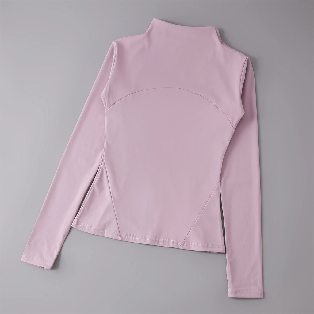 Pink long-sleeve top on a gray background
