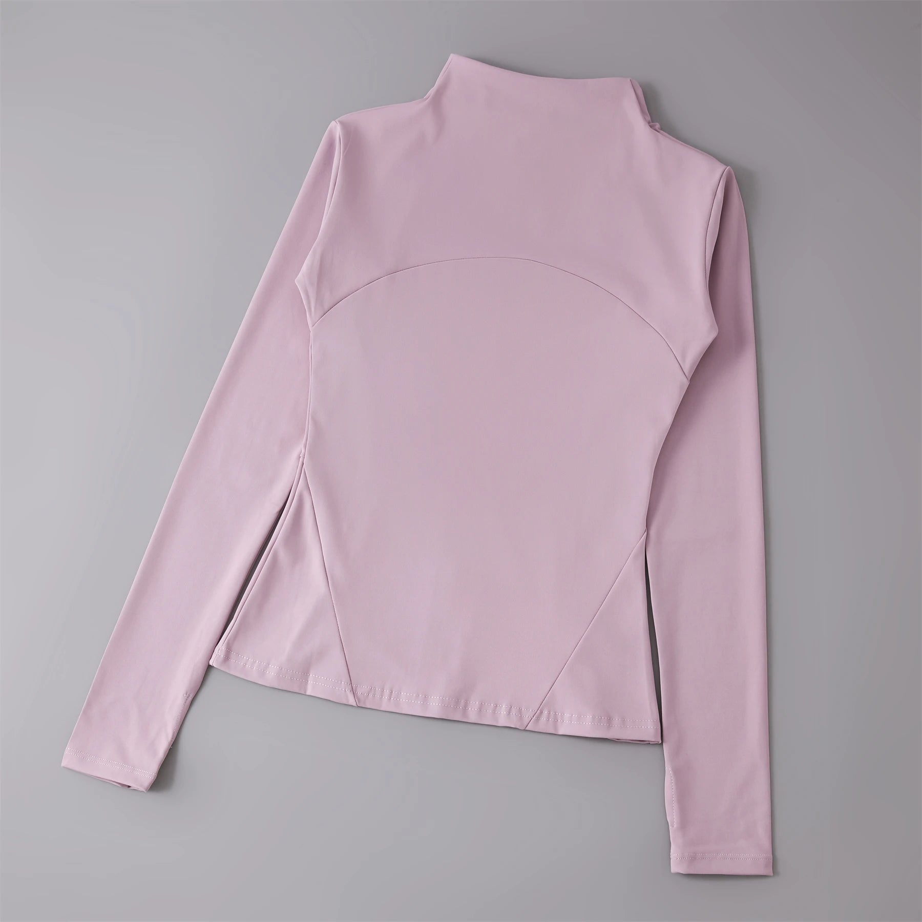 Pink long-sleeve top on a gray background