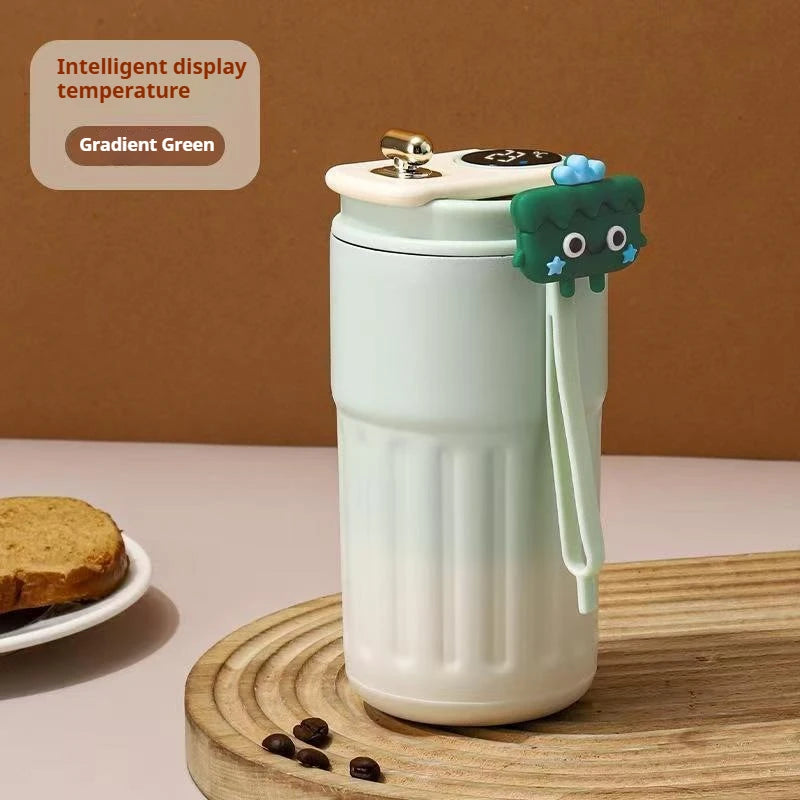 White  and green accents thermos travel mug.