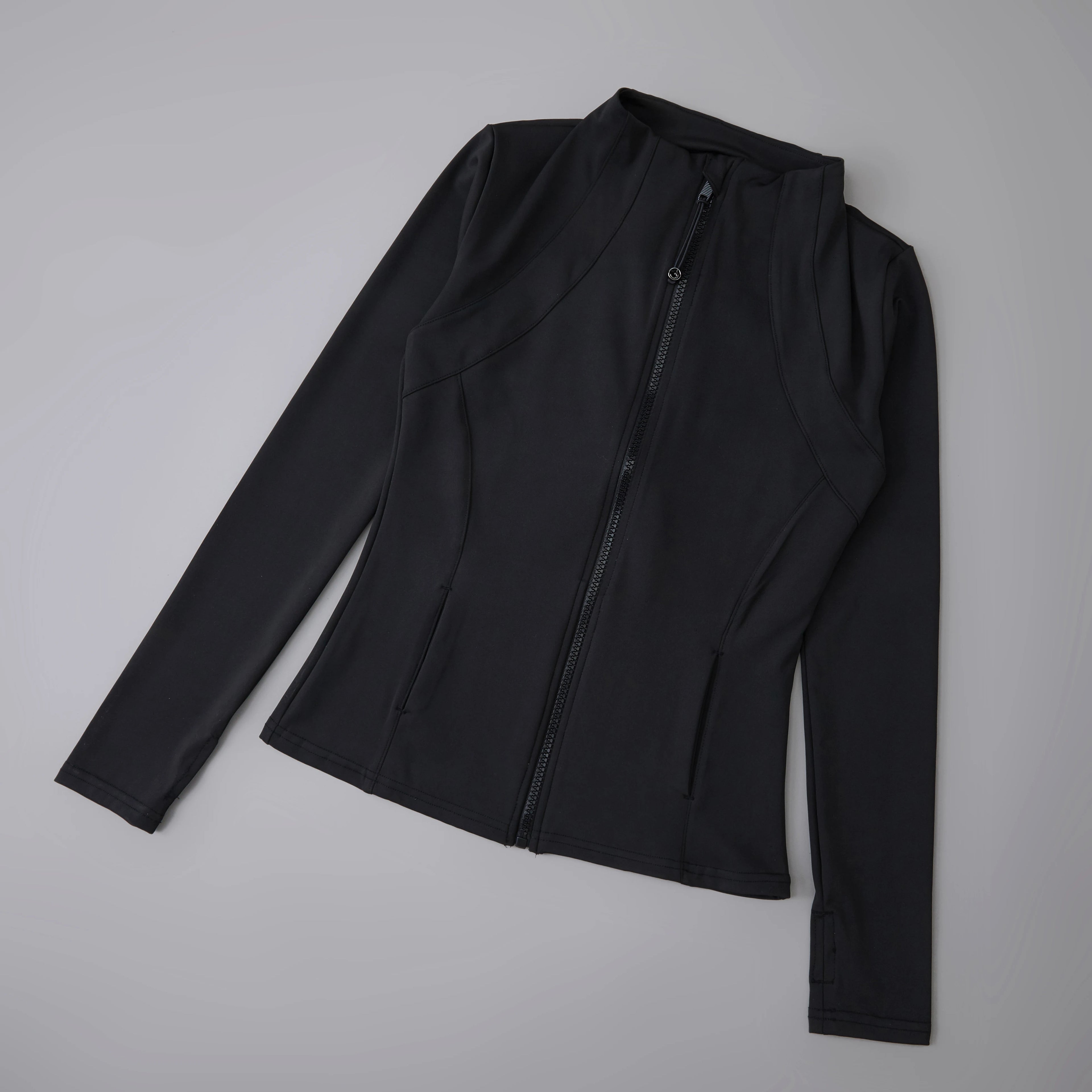 Simple Black active wear jacket on a gray background