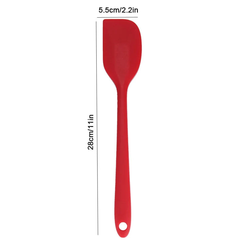 Red spatula with measurements on a white background