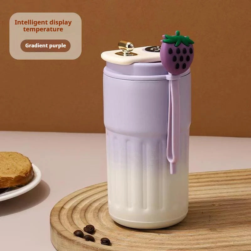 Gradient purple tumbler  mug with a plant design.