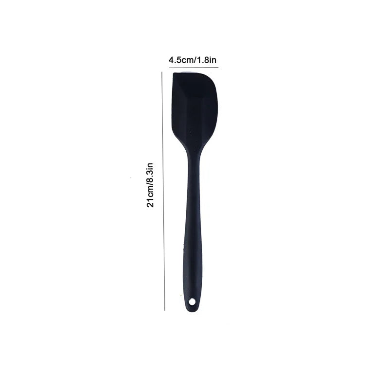 Black spatula with measurements on a white background