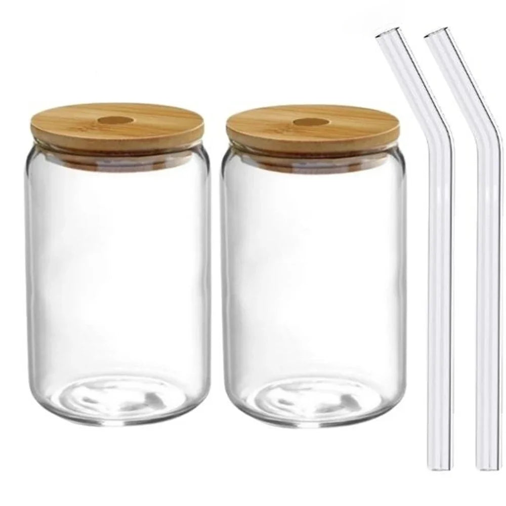 Two glass jars with wooden lids and two clear straws on a white background