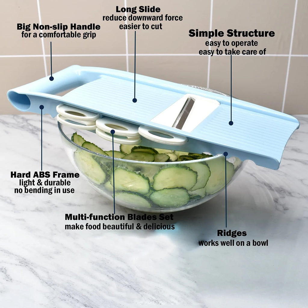 Sliced cucumber in a mandoline slicer with labeled features on a marble surface.