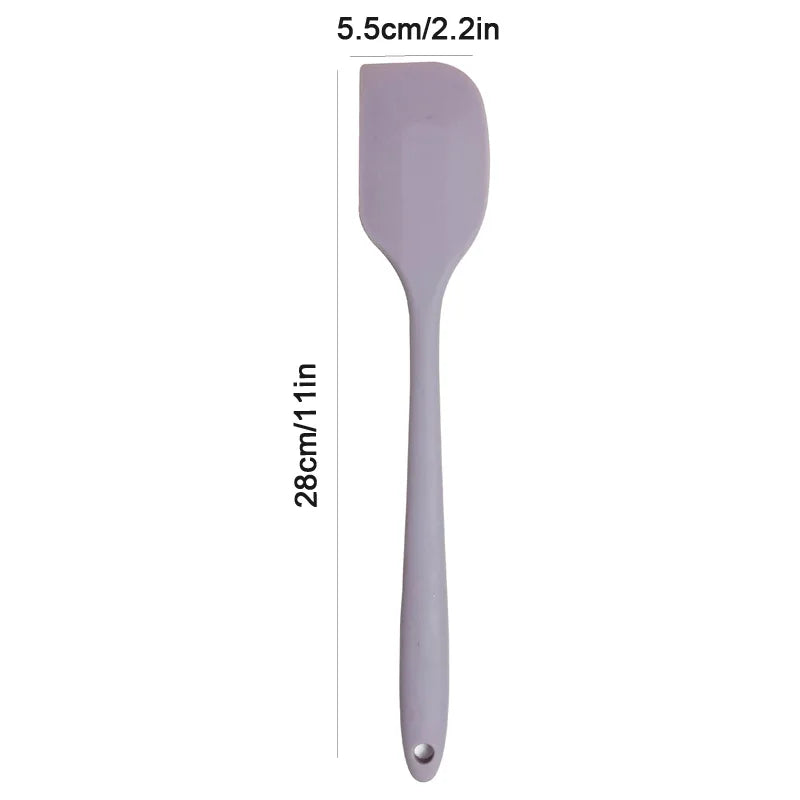 Silicone spatula with measurements on a white background