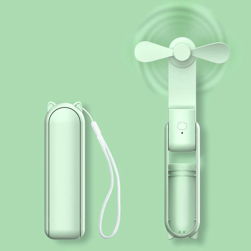 Portable fan with carrying case on a green background