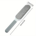 Gray pet grooming brush with measurements on a white background