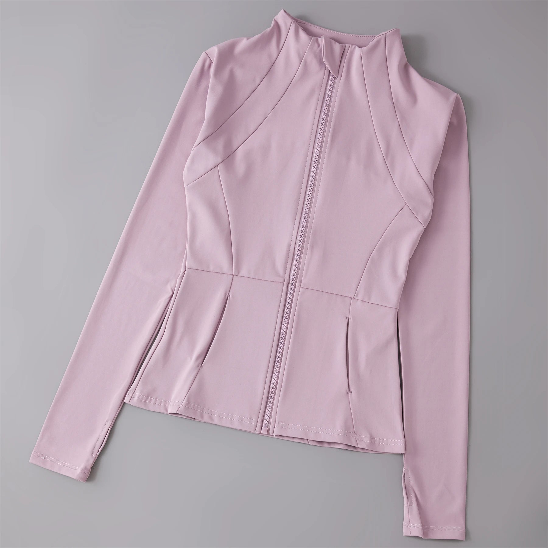 Beautiful Pink activewear  long-sleeve top with a zipper on a gray background