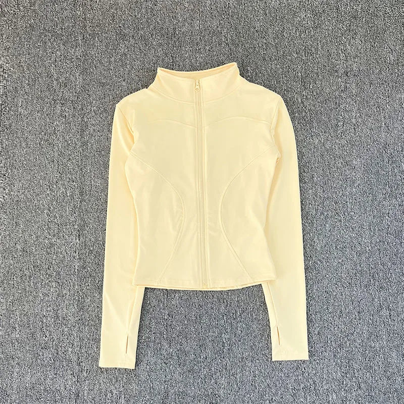 Light yellow zip-up sweatshirt on a gray textured background