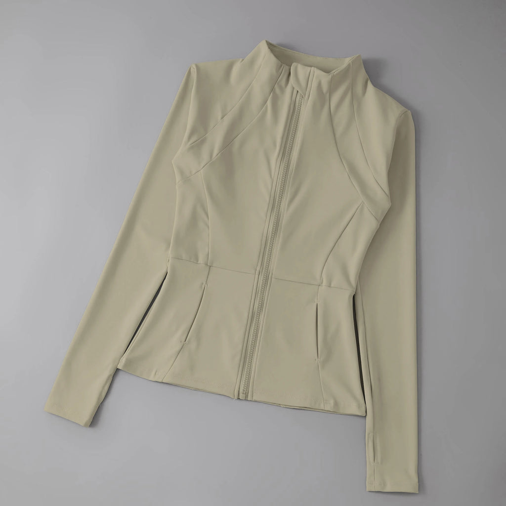Beige long-sleeve top on a gray background