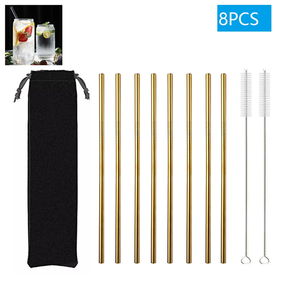 Set of gold metal straws with a black pouch and cleaning brush on a white background.